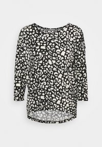 Haut à manches longues noir et blanc avec un motif léopard, encolure ronde et design à ourlet arrondi pour plus de style. Texture de tissu douce.