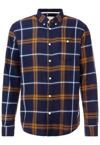 Chemise à boutons à carreaux bleu et jaune avec manches longues, tissu léger, poche poitrine et boutons en plastique blanc.