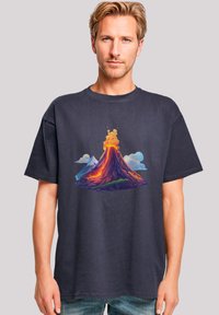 Navy blue cotton T-shirt featuring a colorful volcanic eruption graphic; short sleeves, round neckline, relaxed fit.
