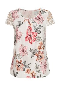 Bloemenblouse met korte kanten mouwen, crème als basis, met roze, oranje en grijze bloemen. Lichtgewicht stof, ronde halslijn, losse pasvorm.