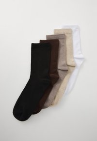 Five pairs of socks in various colors: black, dark brown, light brown, beige, and white. Ribbed texture, mid-calf length, cotton blend.