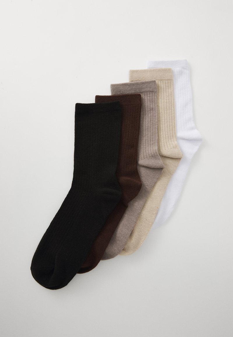 Five pairs of socks in various colors: black, dark brown, light brown, beige, and white. Ribbed texture, mid-calf length, cotton blend.
