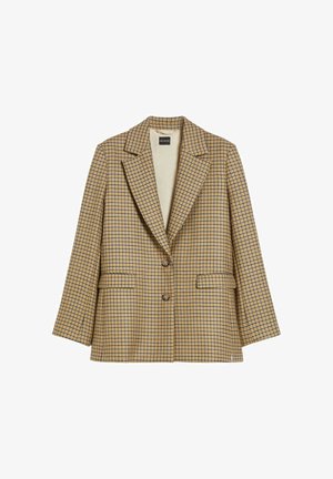 Blazer a quadri beige e blu navy, con rever a lancia, due tasche frontali e chiusura a due bottoni. Tessuto strutturato con vestibilità sagomata.