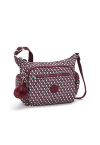 Mehrfarbige Schultertasche mit einem geometrischen Muster in Burgunderrot, Grau und Blau, ausgestattet mit einer Vorderreißverschlusstasche und einem Affenanhänger.