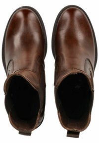 Bottines en cuir marron avec une finition lisse, bouts ronds, panneaux latéraux élastiques et languettes pour un enfilage facile. Semelles en caoutchouc noir.