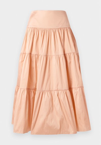 Φούστα σε ροδακινί χρώμα με επίπεδα που είναι φτιαγμένη από ελαφρύ υλικό. Διαθέτει φαρδύ λάστιχο στη μέση και μαλακή, απόκρυφη υφή σε όλη την επιφάνεια.
