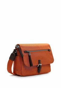 Orange canvas messenger bag with a flap closure, brown leather accents, and a front zipper pocket. Adjustable shoulder strap included.