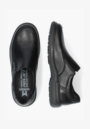 Black leather slip-on shoes with a rounded toe, textured upper, visible stitching, and a rubber sole featuring a patterned tread.