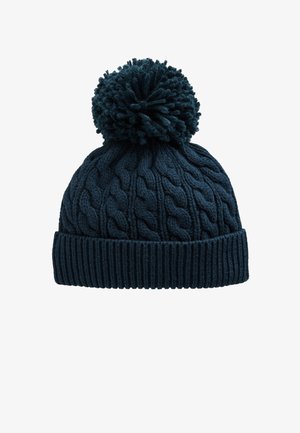 Ciemnoniebieska zimowa czapka z grubym splotem, z podwiniętym brzegiem i dużym pomponem na górze.