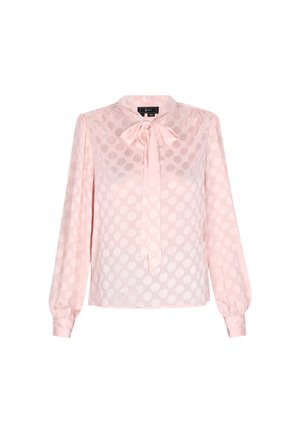 Heledate roosa, pika varrukaga pluus, millel on lipsuga kaelus, polka täppidega muster ja läbipaistev kangas. Sellel pluusil on kitsad mansetid.