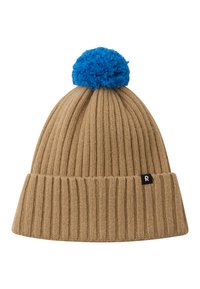 Tan knitted beanie with vertical ribbed texture, featuring a blue pom-pom on top and a black tag with a white "R" logo on the side.
