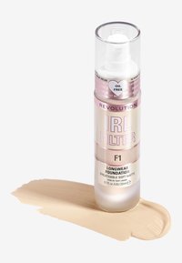 Revolution IRL Filter langvarig foundation F1 i en klar pumpeflaske. Materiale: plast. Farge: beige med en myk matt tekstur. 23 ml.