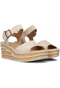 Beige instapsandalen met sleehak, voorzien van twee verstelbare banden en een kurkachtige basis. Heeft een open teen ontwerp en een gevoerd voetbed voor comfort.