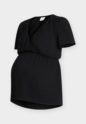 Haut de maternité noir à manches courtes, style cache-cœur avec col en V, et taille élastique froncée pour le confort et l'ajustement.