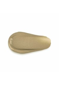 Crema beige con una consistenza liscia e lucida, a forma di goccia. Presenta particelle fini visibili e una finitura leggermente riflettente.