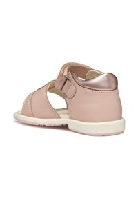 Sandal in rosa pallido con design aperto, tomaia in pelle liscia e accentuazione del tacco in oro rosa metallico. Chiusura in Velcro per una facile indossabilità. Suola in gomma.