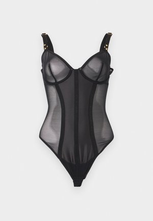 Mustast läbipaistvast võrgust bodi, millel on traadikandjaga tissikatted, reguleeritavad kuldsed riistvaraga õlapaelad ja kujundamiseks vertikaalsed õmblused.