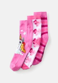 Three pairs of socks: one pink with a unicorn and rocket design, one white with pixelated hearts, and one pink striped pattern.