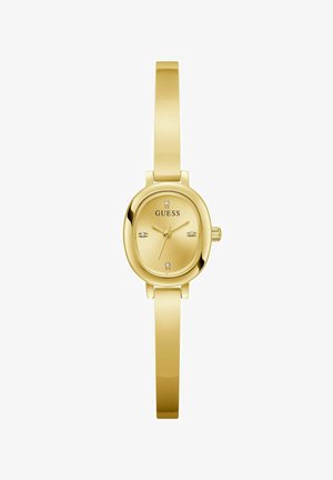 Gold-tone watch with an oval dial, a metal strap, and five crystal accents. The brand name "GUESS" is displayed on the dial.