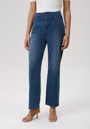 Høyt livd denimbukser i mørkeblått med knappdetaljer foran, rett ben-design og minimalt med falming. Glatt tekstur og klassisk stil.