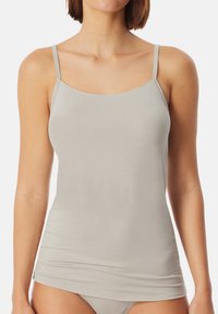 Light grey camisole with thin straps, made from soft, stretchy fabric. Features a scooped neckline and a fitted silhouette.
