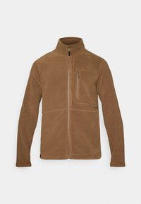 Brun fleecejakke med høy krage, frontlomme med glidelås og brystlomme. Har glatt tekstur og brodert logo på venstre side.