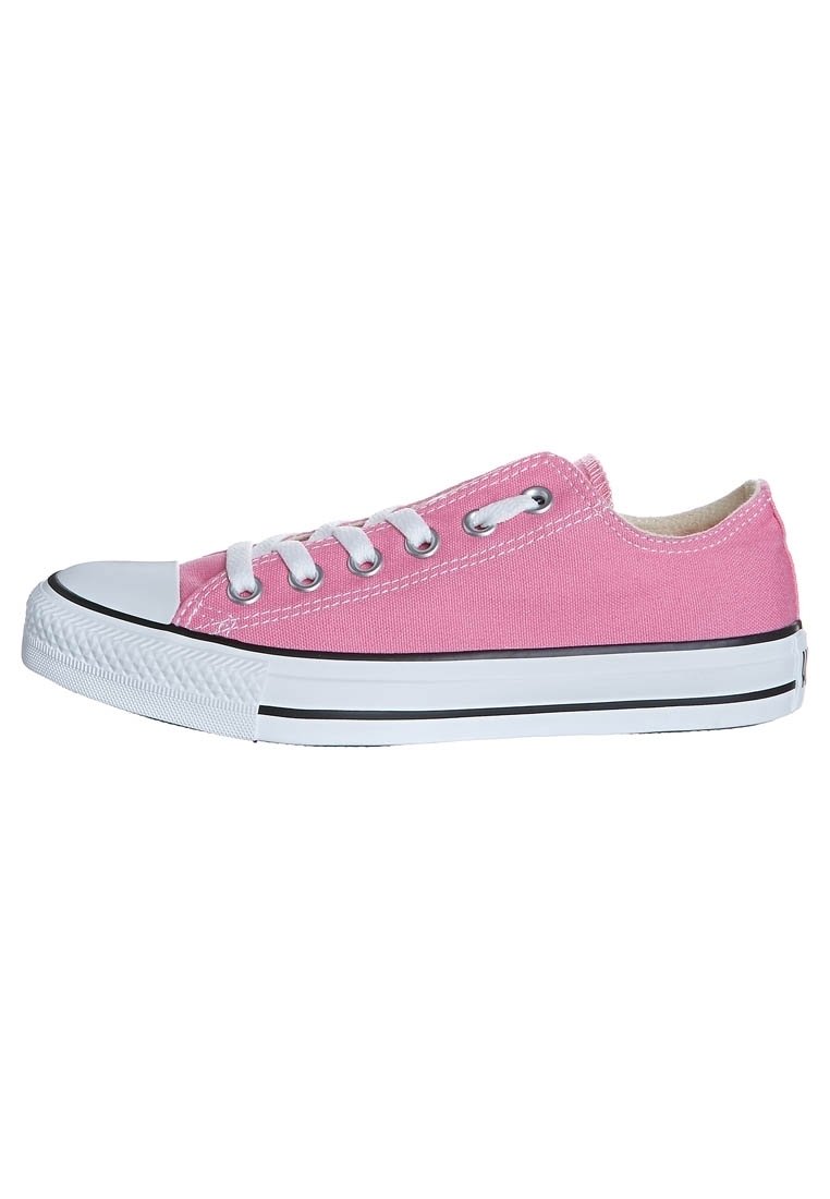 Pink canvas sneaker with white laces, rubber toe cap, and black stripe along the sole. Low-top design with a textured fabric upper.