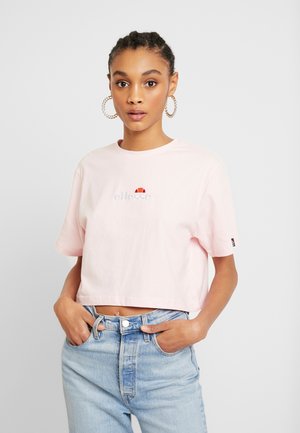 T-shirt court en coton rose clair à manches courtes, avec un petit logo brodé sur la poitrine et une coupe décontractée.