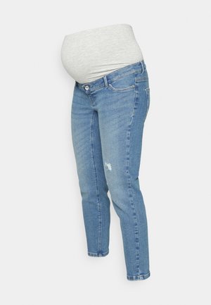 Graviditetsjeans i lyst blå denim med en elastisk grå midje. Har en smal passform og subtil slitasje ved kneområdet.