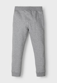 Gray cotton sweats with a tapered fit, elastic waistband, and ribbed cuffs. Smooth texture, simple design, and no visible patterns.
