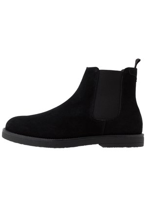 Black suede Chelsea boot with elastic side panel, pull tab at heel, and flat rubber sole.
