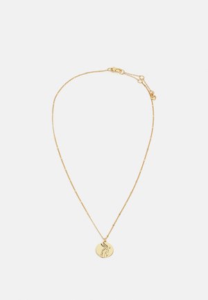 Collier délicat en chaîne d'or avec un pendentif rond gravé d'un contour minimaliste de visage féminin.