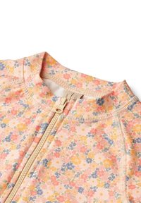 Blomster-lynlåsgarment i lys pink med små gule, blå og orange blomster. Glat tekstur med ståkrave og synlig lynlås.