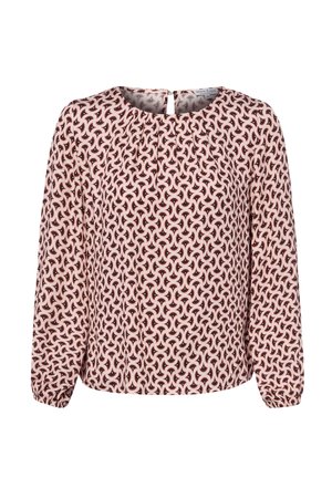 Blouse à manches longues avec motif abstrait en spirale rose, noir et blanc, encolure ronde et poignets froncés aux manches.