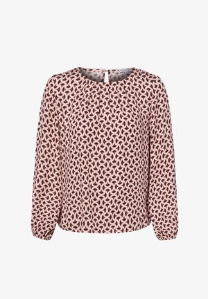 Blouse à manches longues avec motif abstrait en spirale rose, noir et blanc, encolure ronde et poignets froncés aux manches.