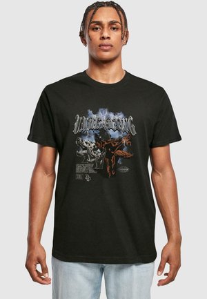 T-shirt en coton noir avec un design graphique comprenant des loups et du texte, col rond, manches courtes, coupe décontractée et ourlet standard.