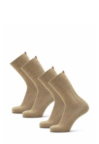 Čtyři páry béžových žebrovaných ponožek do kotníků se řadí v řadě na bílém pozadí.
