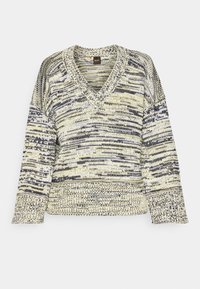 Gestickter V-Ausschnitt-Pullover mit langen Ärmeln in cremefarbenem Grundton mit schwarz-grau meliertem Muster, gerippte Bündchen und Saum.