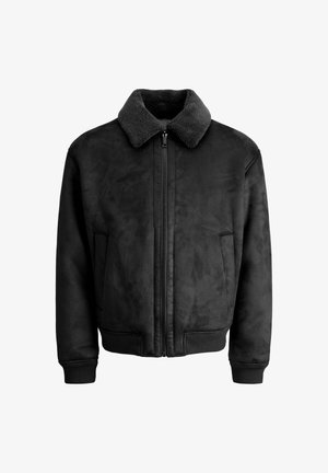 Schwarze Bomberjacke aus Kunstwildleder mit weichem, strukturiertem Kragen, Frontreißverschluss und Seitentaschen. Mit gerippten Bündchen und Saum.