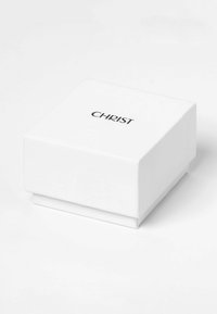 White square jewelry box with a smooth finish and a black printed "CHRIST" logo on the top. Closed, with a clean, minimal design.