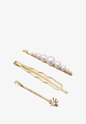 Three hairpins: one gold with white pearls, one wavy gold, and one gold with a diamond-like accent. All feature shiny metal finishes.