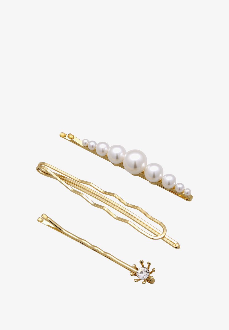 Trois épingles à cheveux : une en or avec des perles blanches, une ondulée en or, et une en or avec un accent ressemblant à un diamant. Toutes présentent des finitions métalliques brillantes.