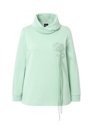 Vaaleanvihreä huppari, jossa on kauluri, vasemmalla puolella brodeerattu kukkakuosi ja pitkät langat yksityiskohtina. Pitkät hihat.