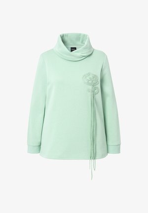 Lichtgroene sweatshirt met een cowl neck, voorzien van geborduurd bloemenontwerp aan de linkerkant en verlengde draden voor detail. Lange mouwen.