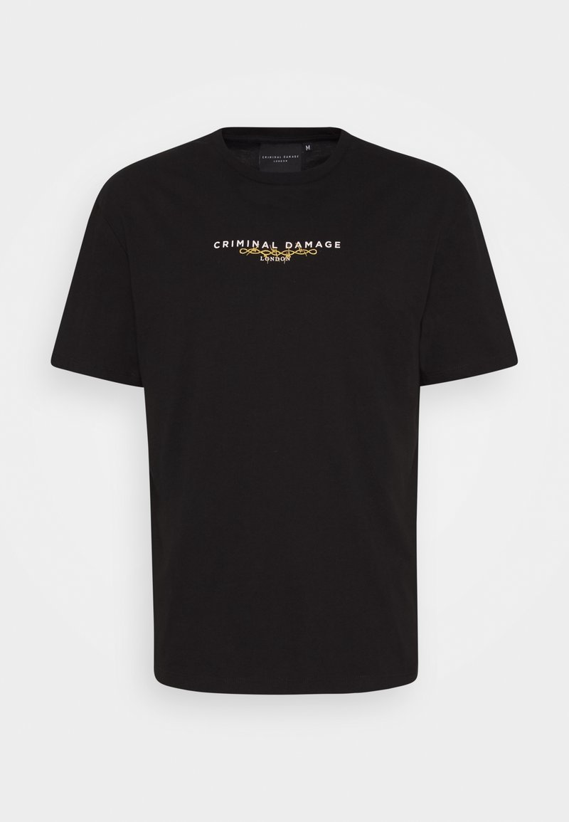 T-shirt nera in cotone con maniche corte. La parte anteriore presenta la scritta "CRIMINAL DAMAGE" e "LONDON" in lettere bianche e dorate. Design standard con collo rotondo.