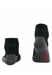 Calcetines de tobillo negros y grises con textura acanalada; presentan un logo en el puño y una suela texturizada con acentos rojos para mayor agarre.