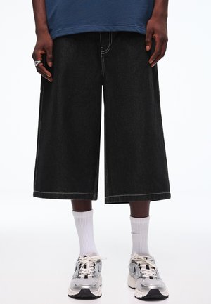 Bershka SUPER  BAGGY - BERMUDA  - Denim shorts - black
