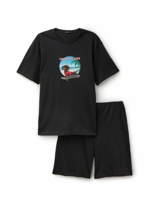 Czarny zestaw z krótkim rękawem T-shirt i szortami z grafiką jamnika jeżdżącego na deskorolce na plaży, z podpisem "Enjoy the Ride."