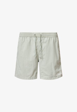 Lichtgroene zwembroek met een elastische tailleband, verstelbaar trekkoord en een klein wit logo aan de linkerkant. Glad materiaal.