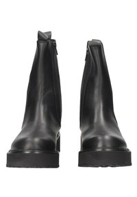 Bottines en cuir noir au design épuré, dotées d'une fermeture éclair haute sur le côté et d'une épaisse semelle en caoutchouc pour une bonne adhérence et stabilité.